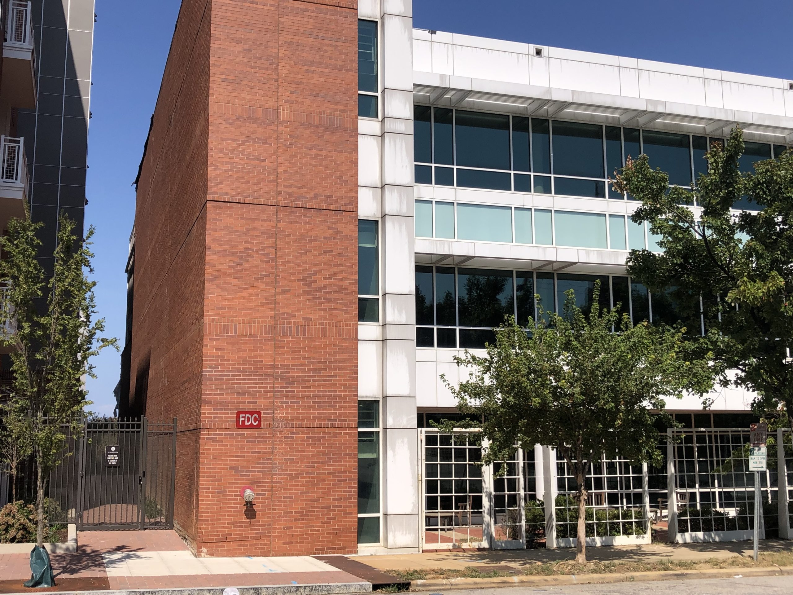Commercial building with upper exterior windows serviced by Patriot Softwash in Raleigh, NC