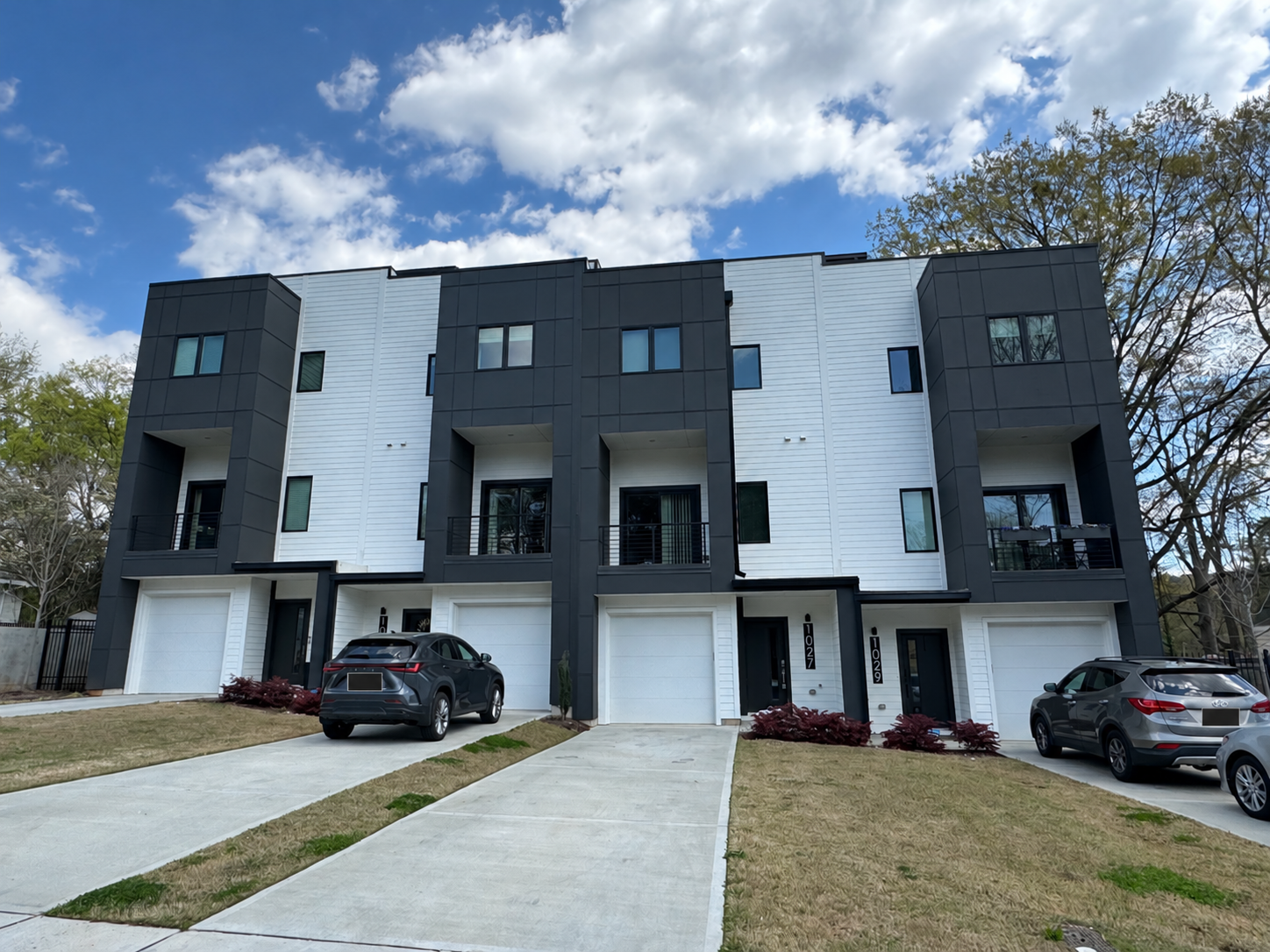 Modern three-story townhomes after exterior soft washing by Patriot Softwash in Raleigh, NC